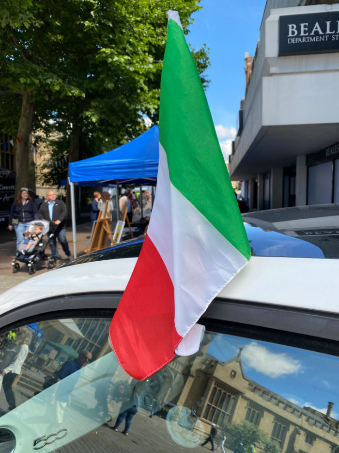 Italian flag on top of a car at the Italian Festival