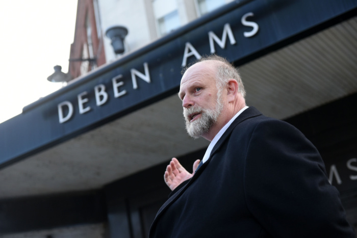 Mayor Tom Wooton standing in front of the former Debenhams building in Bedford.