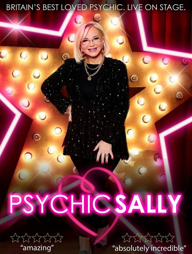 Bedford Corn Exchange Psychic Sally in front of giant star with lights and pink LED light