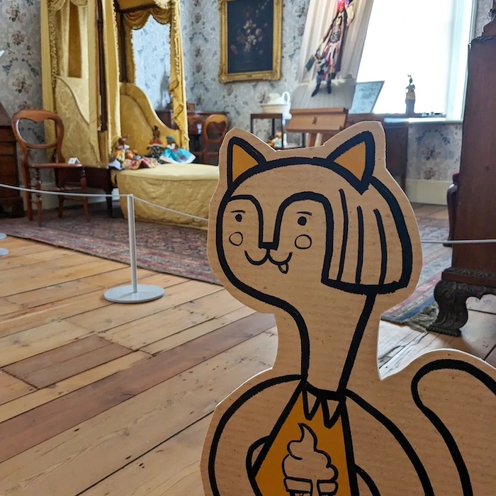 A wooden model of a cat in a bedroom. Part of the Fun Palaces event at The Higgins