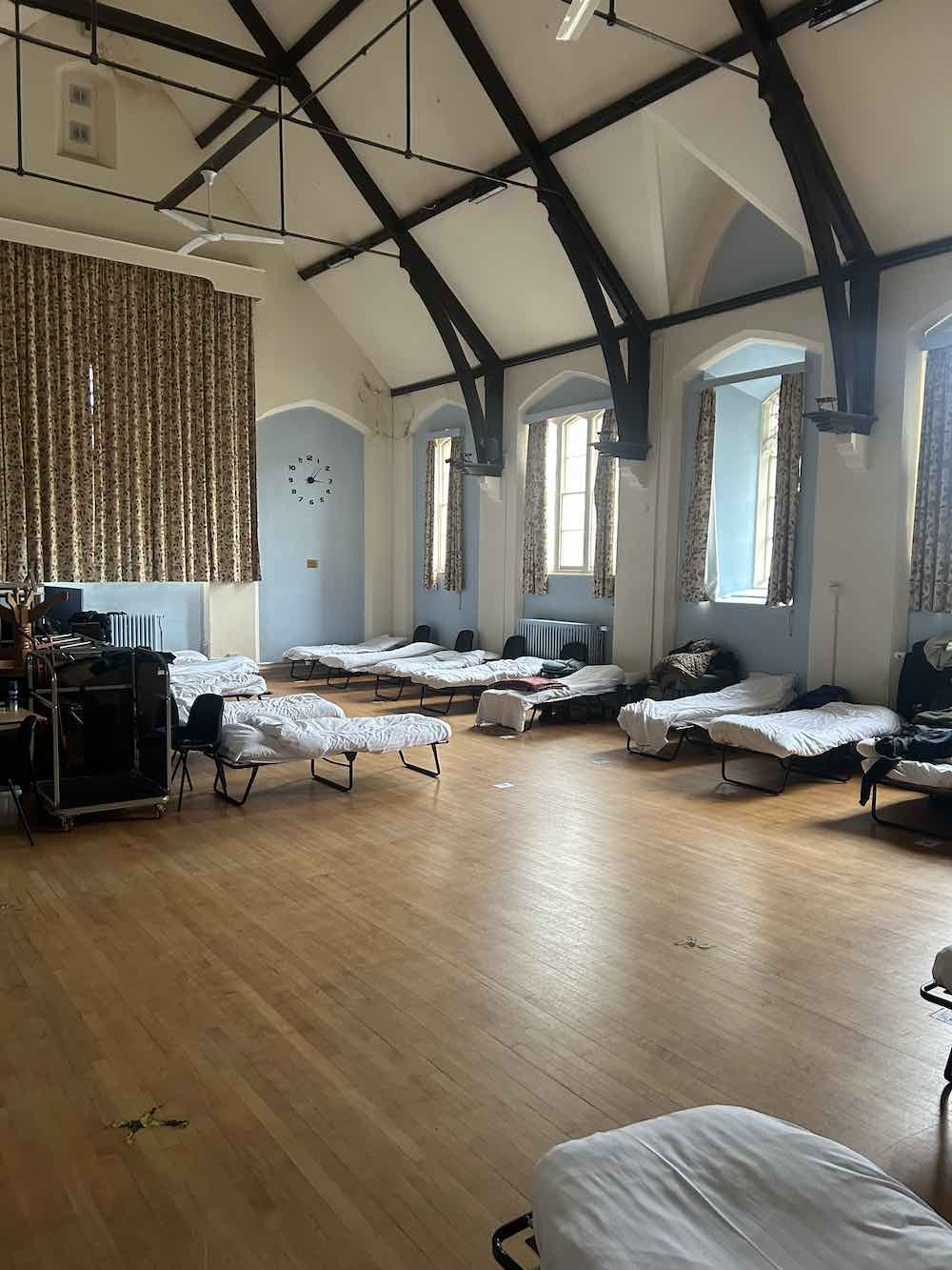 single beds in a row at Bedford's Winter Night Shelter