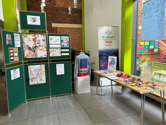 An exhibition in The Higgins Bedford featuring posters for LGBTQ+ month