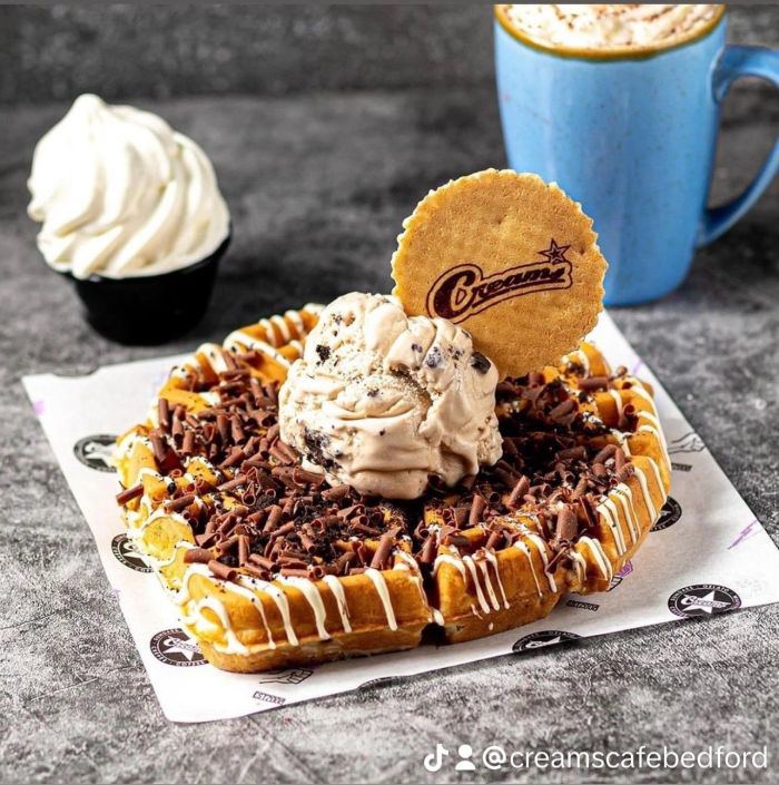 Waffle with ice cream and coffee with ice cream on the side