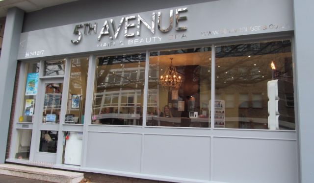 5th Avenue shopfront in soft grey and silver with large windows showing salon and products