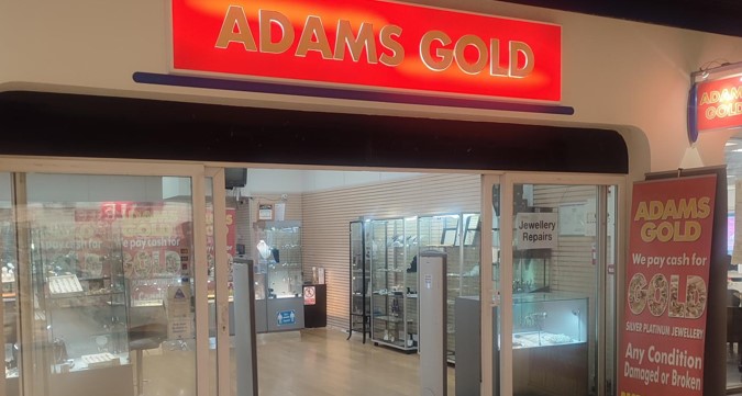 Adams Gold shopfront with red signage