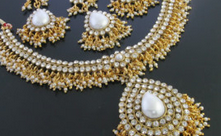 Adams elegant, glamorous gold and pearl earrings and matching necklace