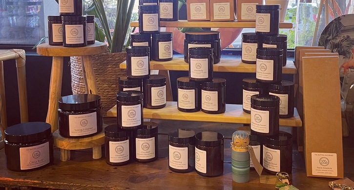 Arc candles in jars on shelves