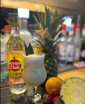 Auction Room Pina Colada with Havana rum, pineapple and fruit