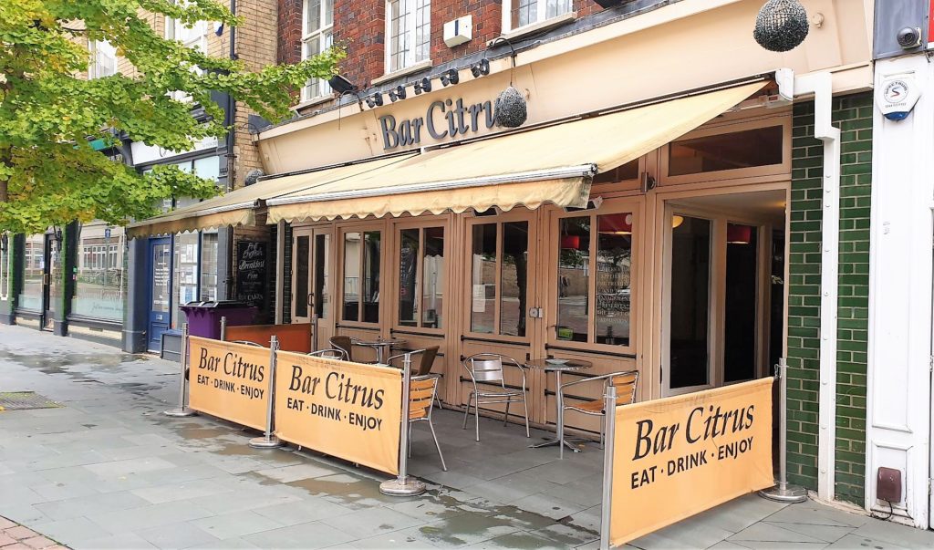 Bar Citrus front, yellow awning and outdoor seating