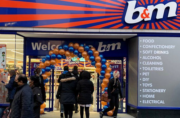 B&M Shopfront with balloons and people walking in