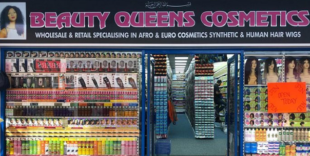 Beauty Queen shopfront with pink writing on black background showing a range of hair products
