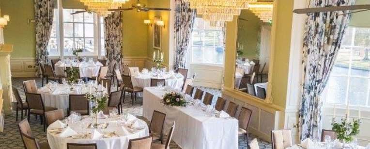 Bedford Swan Hotel wedding room with tables set and pretty curtains