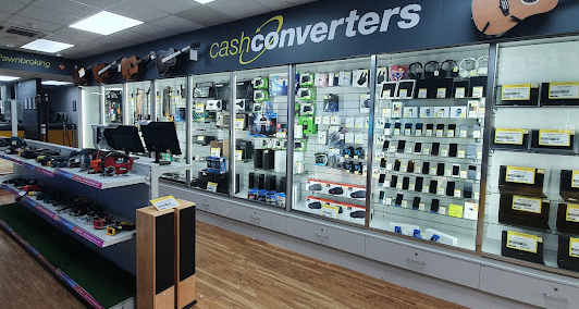 Cash Converters shop interior with cabinets of phones, cameras and gadgets