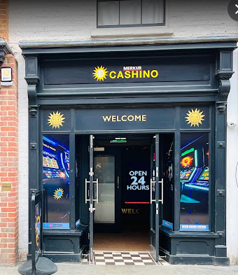 Cashino street view with gold lettering on grey boarding