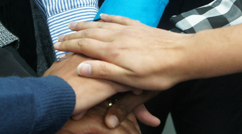 Counselling Foundation group of hands together showing support