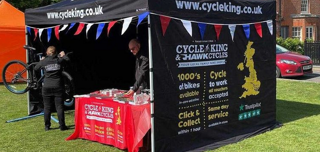 Cycle King black and white stand at event