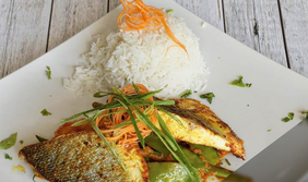 Fish curry on square white plate