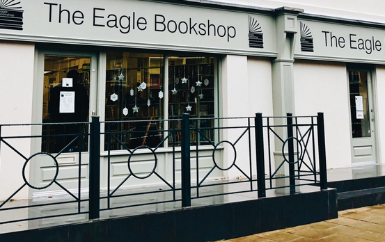 Eagle bookshop storefront with pale grey and white boarding