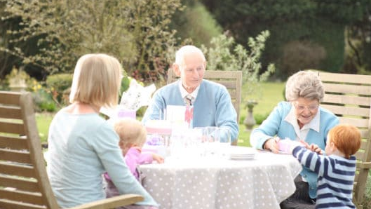First2Care elderly couple with family in an outdoor setting