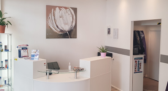 Footcare4Eva clean, white, stylish reception area and desk