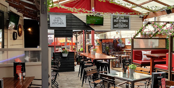 George & Dragon outdoor covered seating with tables, chairs and booths