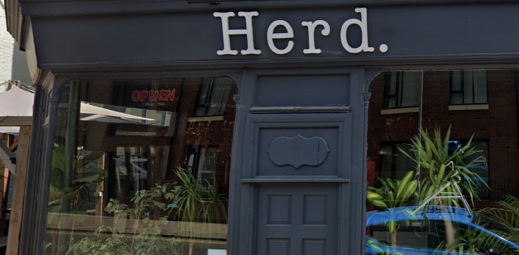 Herd shopfront with grey window surrounds and white wording