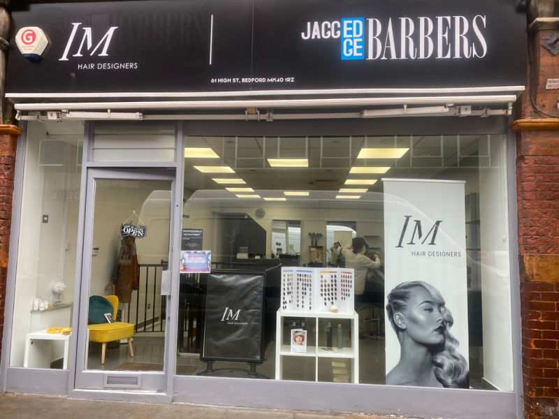 Shopfront for IM Hairdesigners on Bedford High Street.
