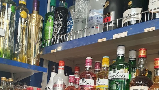 M&M Off Licence shelves of spirit alcohols