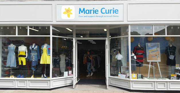 Marie Curie Bedford shop with yellow and blue logo