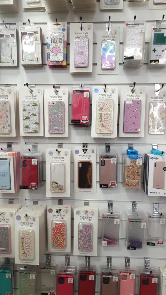 Happyfones mobile phone cases all displayed on hangers