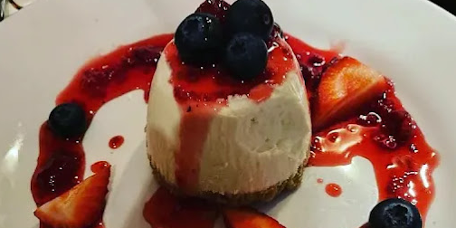 Miller & Carter pannacotta with berries and berry coulis