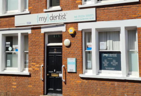 MyDentist clinic frontage, period red brick and white windows.