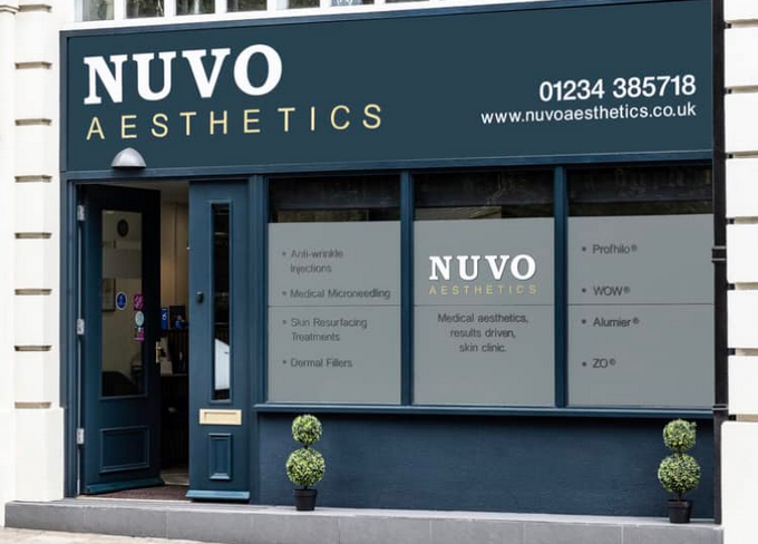 Nuvo shopfront branded with white and gold writing on grey/blue boarding, door and windows