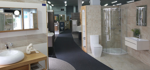 P & R Interiors bathroom showroom with designer showers, toilets, sinks and cabinets