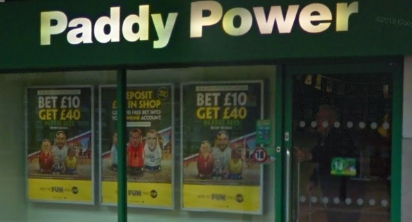 Paddy Power shopfront green boarding and yellow words