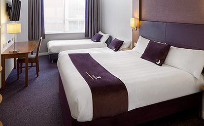 Premier Inn family room with king bed and two single beds