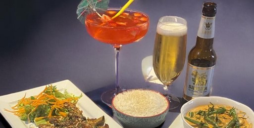 Rice Thai meal with cocktail and beer