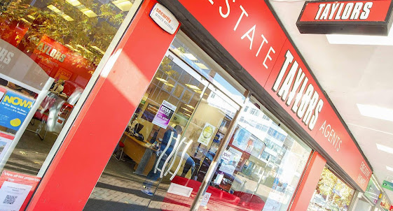 Taylors Estate Shopfront red, white and black logo and branding