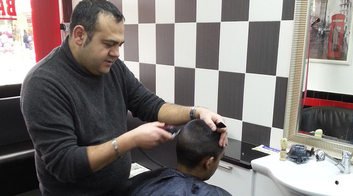 The Berber barber cutting hair