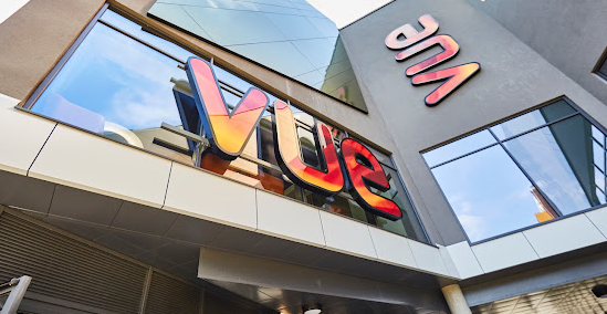 Vue Bedford entrance with signage in fiery pattern and colours