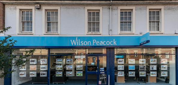 Wilson Peacock shopfront with blue and white signage