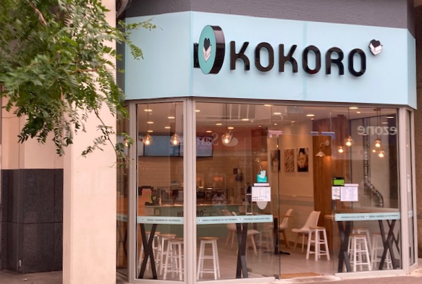 Kokoro shopfront with large glass window and pale blue, white and black fascia