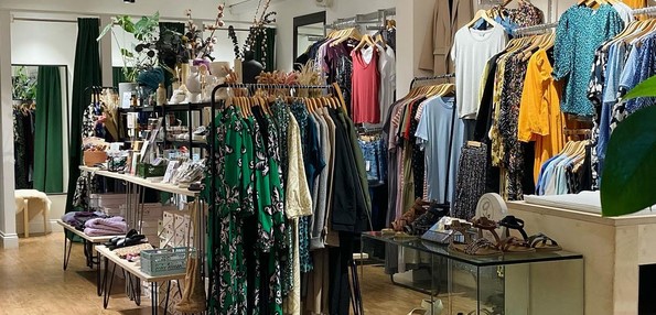 Planet Boutique shop interior with rails of dresses and shoes