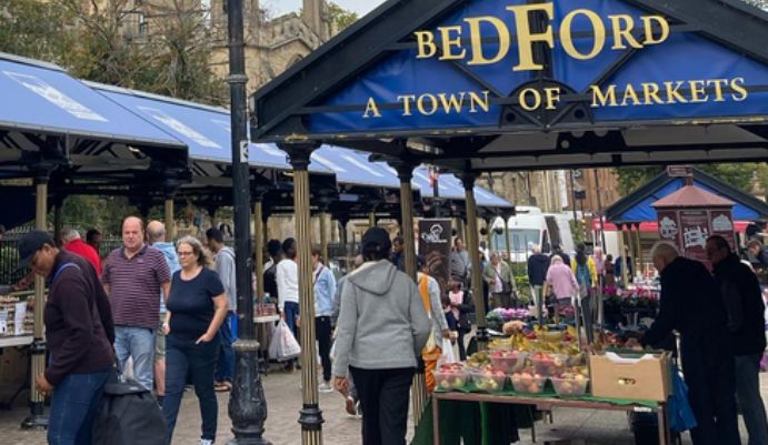 Bedford Markets with stalls and people walking around