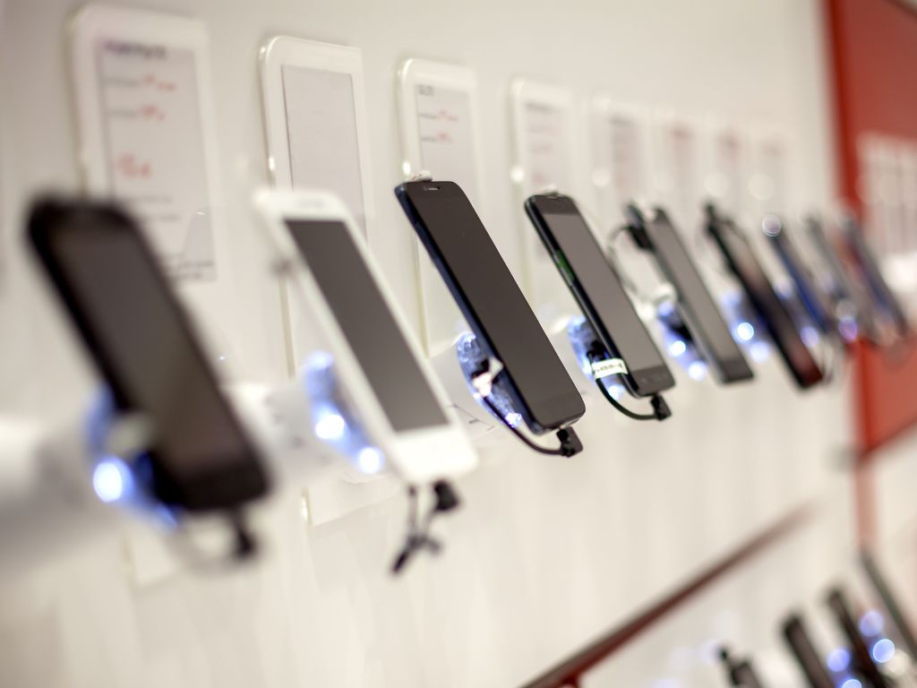 Phones lined up in a phone shop