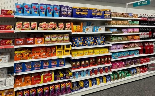 Poundland shelves with packets of chocolates and sweets