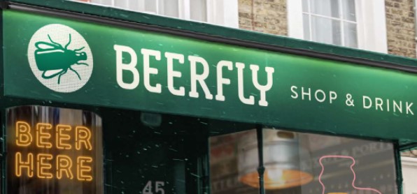 Green sign with the words Beerfly