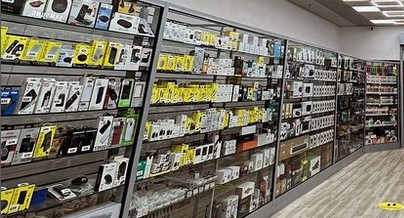 Ifix Bedford store with shelves of phones and headphones