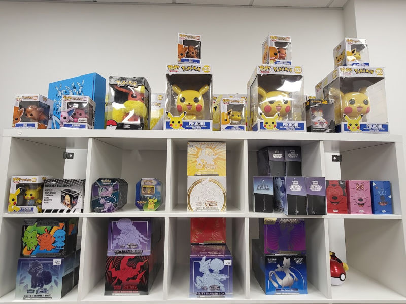 Picachu and a selection of anime charachers on a shelf.