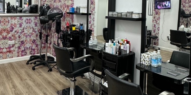 DHD Hair Design customer chairs, mirrors and floral wallpaper
